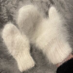White fluffy warm winter mittens